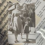 Black and white vintage photograph of two women walking arm in arm down a street, both smiling, dressed in mid-century blouses and skirts. The photo rests on top of sheet music and a typed City of San Antonio proclamation honoring the municipal dance program.
