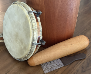 A güiro (scratch gourd) and a pandereta (hand-held frame drum), the two instruments at the heart of plena.